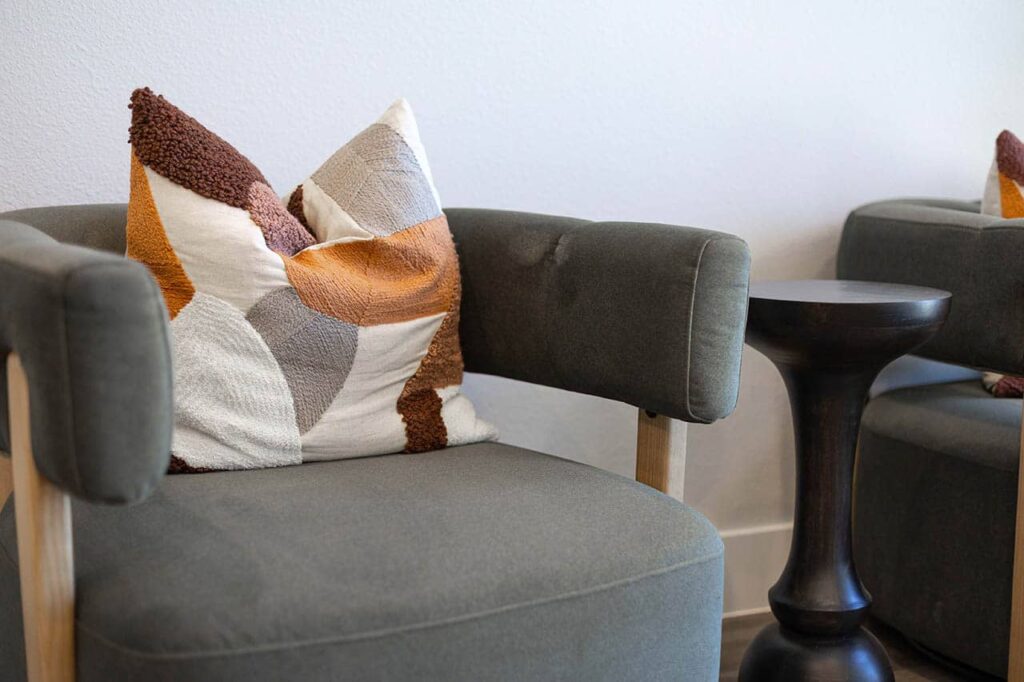 Closeup of a pillow on an armchair